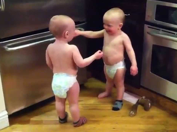 Twin baby boys have a conversation...